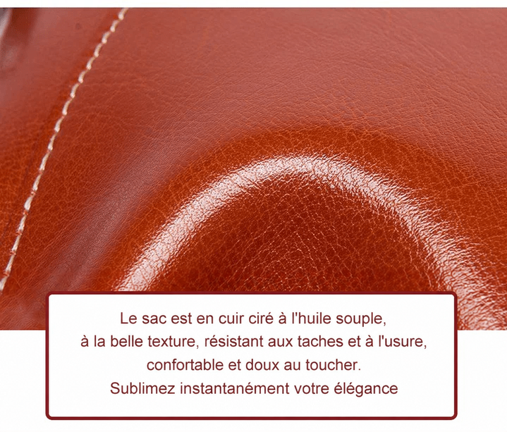 Gros plan sur la texture du cuir ciré brun roux, souple et brillant, avec une couture apparente 14