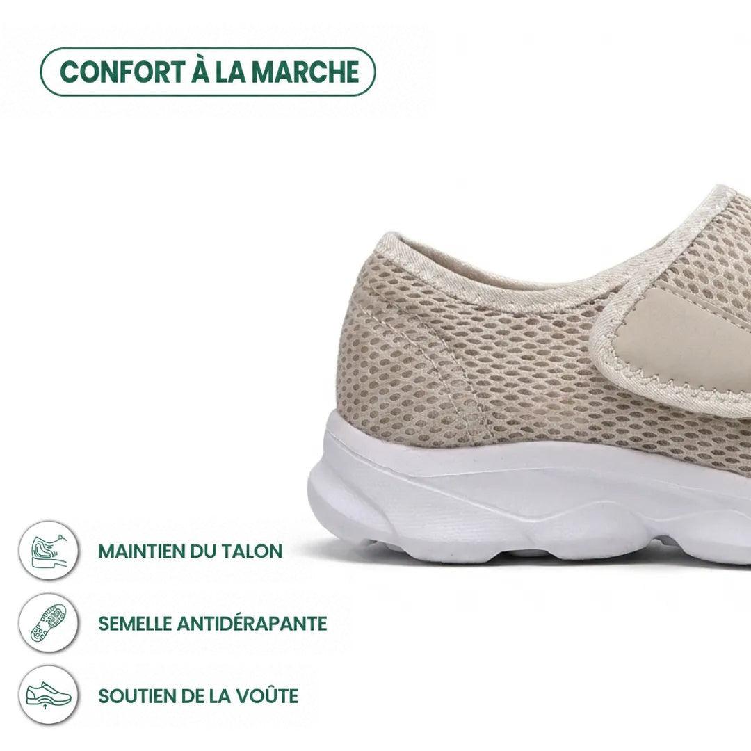 Détail du talon d'une chaussure beige en mesh avec semelle blanche, sangle auto-agrippante et pictogrammes sur le maintien du talon, l'adhérence et la voûte. 31