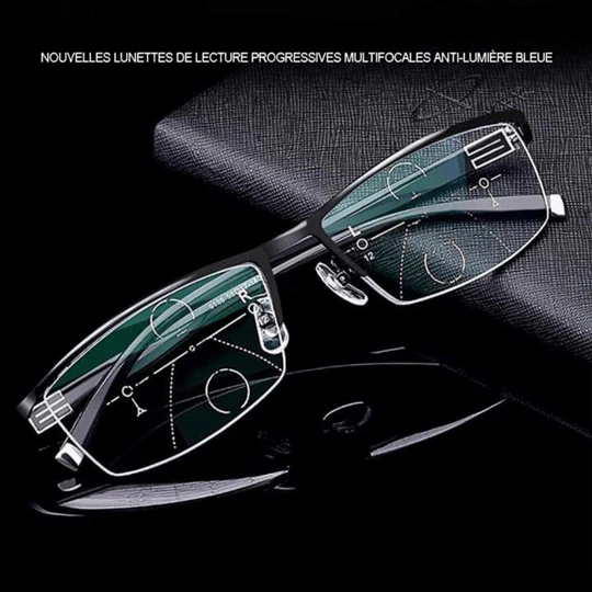 Lunettes à monture métallique noire posées en biais sur une surface sombre, verres progressifs visibles 1