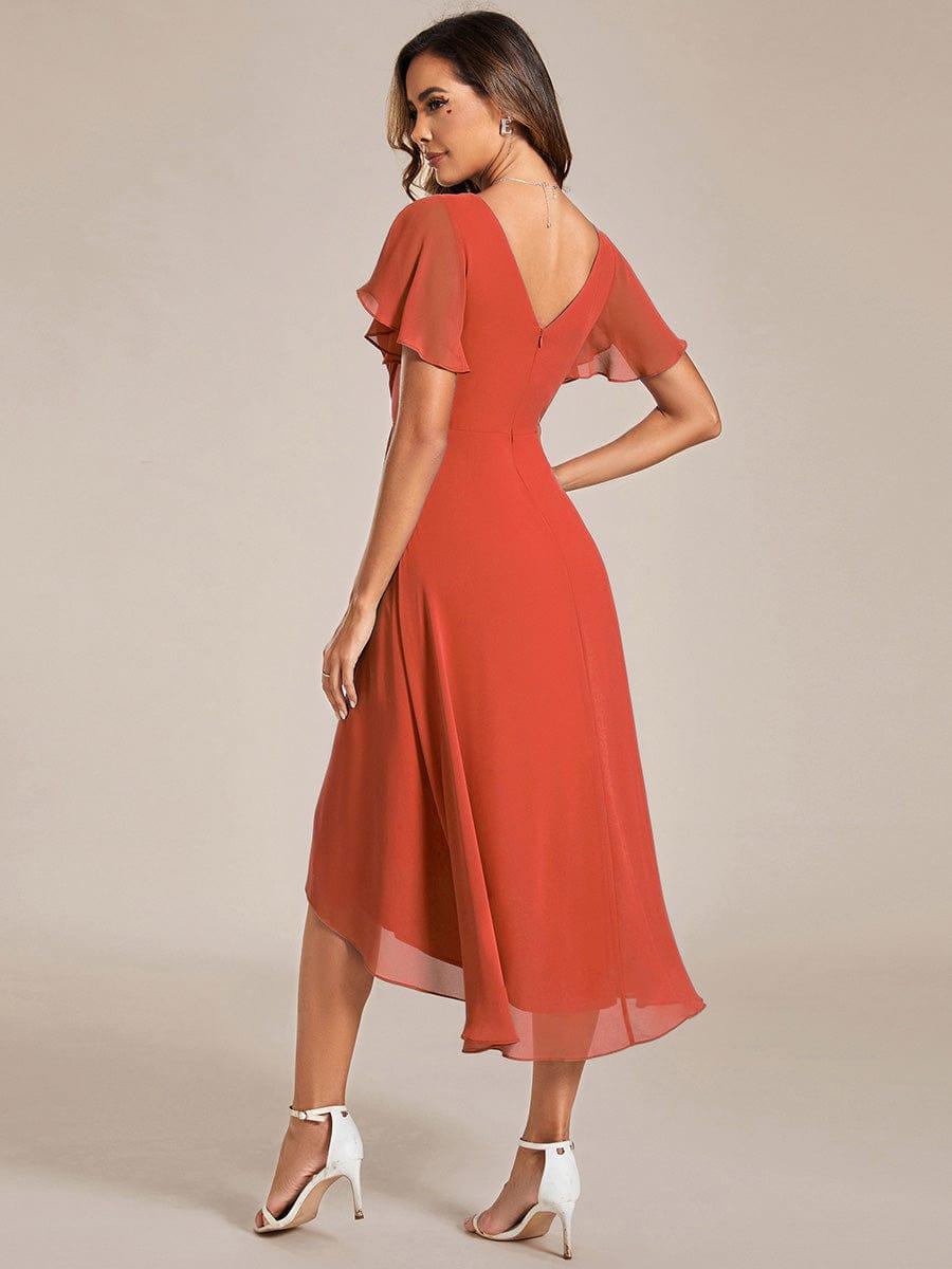 Vue de dos de la robe orange terracotta, dos en V avec zip, manches papillon et jupe asymétrique 93