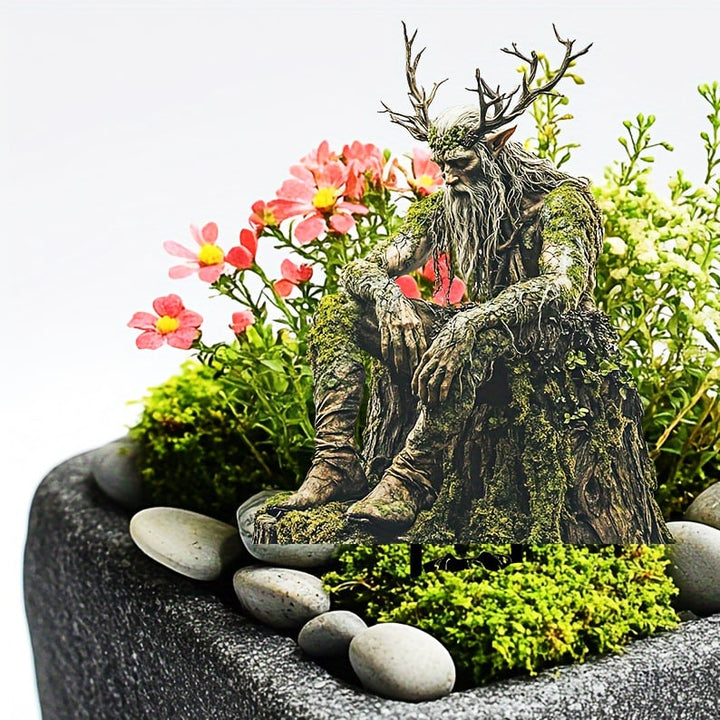 Tuteur de l'esprit des bois aux bois de cerf, installé dans un bac de fleurs roses, de mousse et de galets. 9