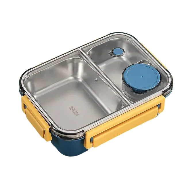 Boîte bento en acier inoxydable à deux compartiments avec couvercle transparent, fermoirs jaunes et petit pot bleu, vue en perspective. 2