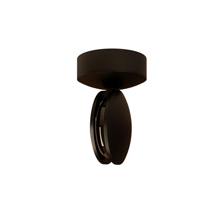 Applique noire isolée sur fond blanc, base ronde au plafond et tête pivotante en disques laissant voir la fente lumineuse. 19