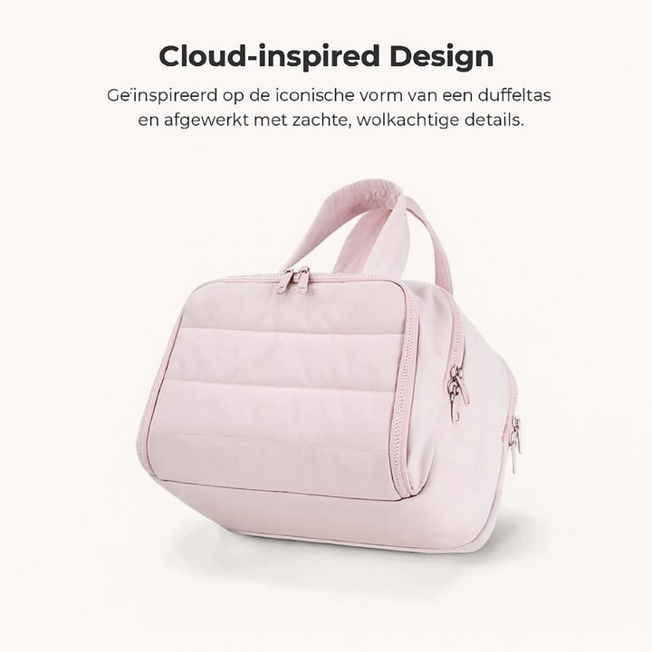 Trousse rose à surface matelassée façon doudoune, vue de trois quarts, avec ses anses douces et ses fermetures éclair. 10