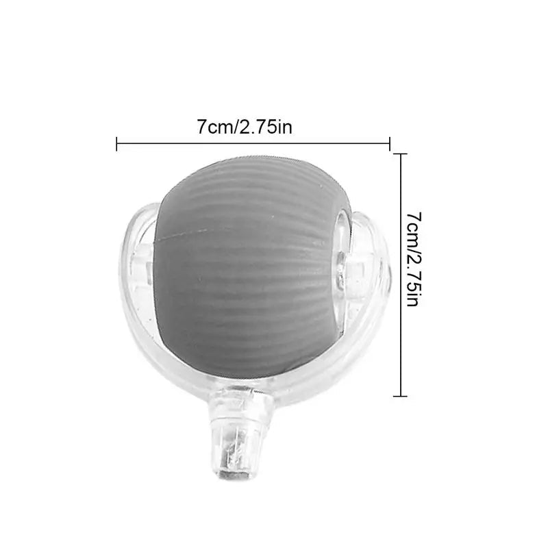 Balle grise dans sa coque transparente, avec cotes indiquant environ 7 cm de largeur et 7 cm de hauteur. 7