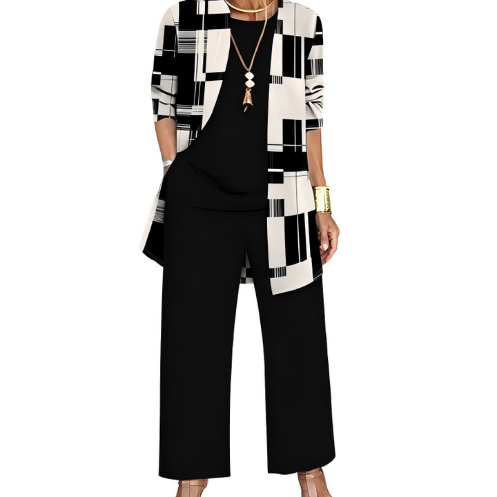 Ensemble noir et crème, cardigan long à motif géométrique de blocs et de rayures, haut noir uni et pantalon large noir. 8
