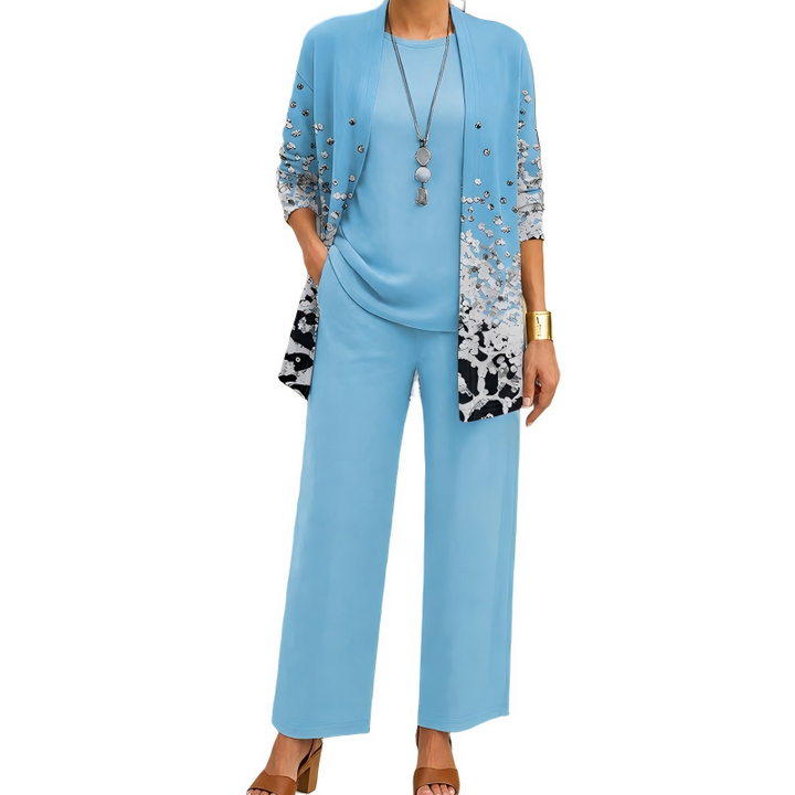 Version bleu ciel, cardigan long à petits éclats argentés dégradés et imprimé noir et blanc en bas, haut et pantalon unis. 11