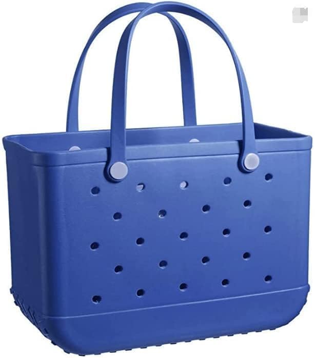 Cabas bleu roi ajouré photographié seul de face, avec deux anses souples et des boutons de fixation clairs. 16