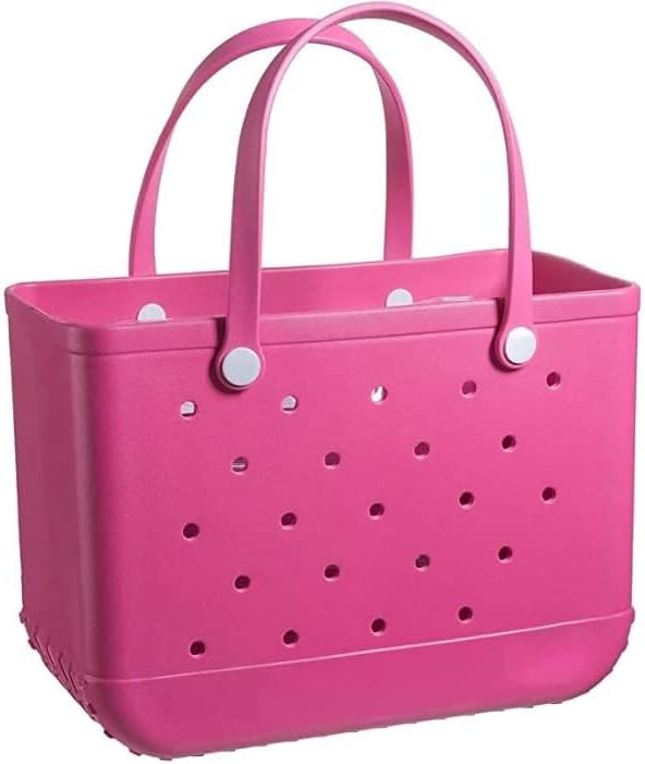 Cabas rose fuchsia ajouré vu de face sur fond blanc, avec ses anses souples et ses boutons de fixation blancs. 17